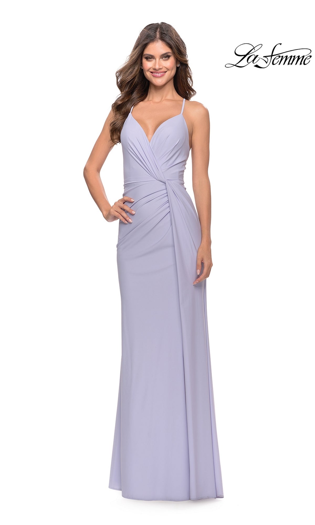 Woman in a Twist-Front La Femme Long Formal Dress 31169—light lavender, open back, thin straps, deep V-neckline, ruched waist;